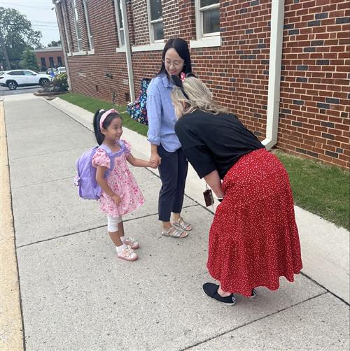 greeter outside Madison Elementary